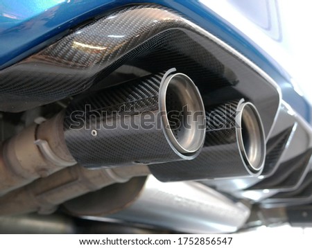 closeup of car exhaust in the garage.