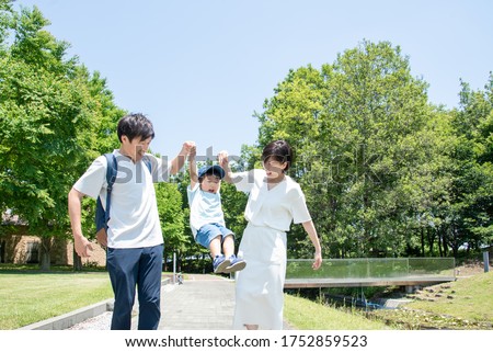 Family walking holding hands under the blue sky Royalty-Free Stock Photo #1752859523