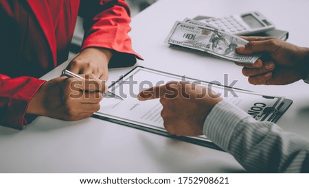business individual who owns the business sign personally sealing the deal with receiving a bribe money.The concept of corruption and anti-bribery
