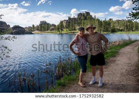 A mother and her teenage son pause for a picture while hiking at Sylvan Lake, South Dakota.