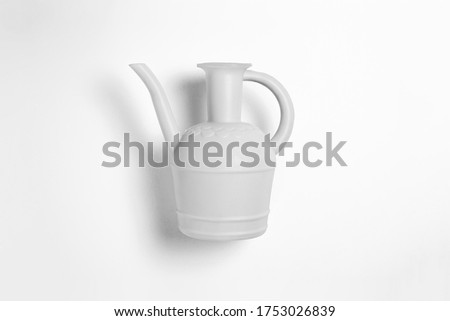 White plastic watering can isolated on white background.High resolution photo.