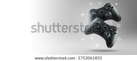 Two gamepads on a light background. Royalty-Free Stock Photo #1753061831