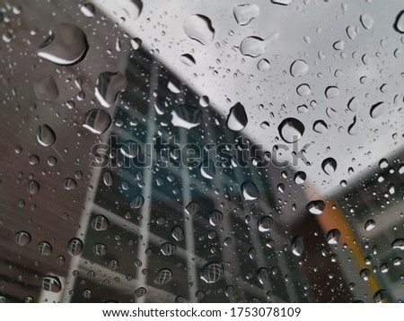 Water droplets on the glass behind the building