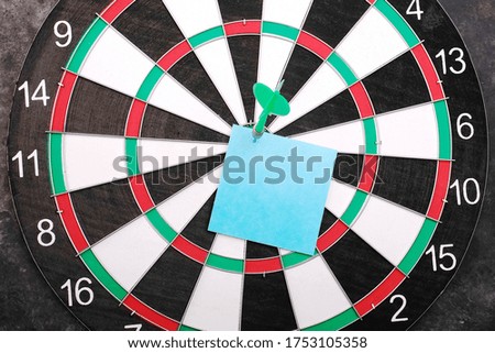 Darts and arrow. Hitting target, success business concept. Pinned paper