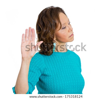 Closeup portrait of senior mature woman with bad attitude giving talk to the hand gesture with palm outward, isolated on white background. Negative emotion facial expression feelings, body language