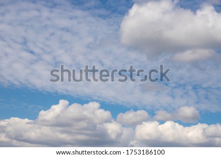 Blue sky and white clouds. Blue summer sky white cumulus clouds. Eco-friendly landscape.
