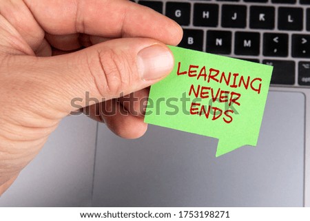 LEARNING NEVER ENDS. Speech bubble and gray laptop. Webinar, skills and education