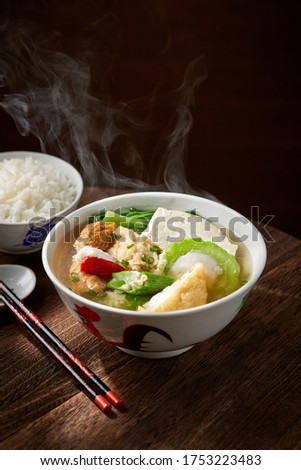 Yong Tau Foo Soup on dark wooden table Royalty-Free Stock Photo #1753223483