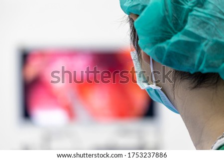 General surgeon looking at Monitor screen during keyhole surgery.Minimal invasive surgery was perform.Selective focus with blurred background.Medical concept.