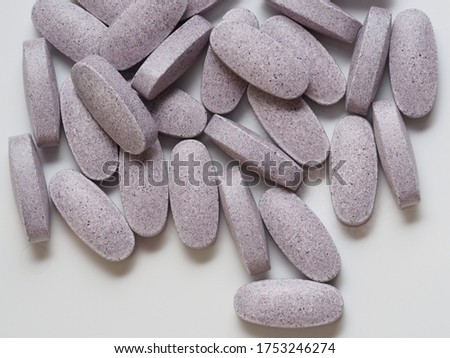 Healthcare: Purple vitamin tablets with bilberry extract for eye vision 