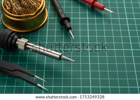 Electronics Development Concept. Hobbies are electronics. Soldering iron and tools on the desktop. Royalty-Free Stock Photo #1753249328