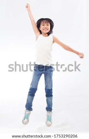little girl jumping when photo studio session