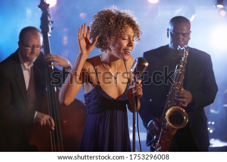 Jazz band on stage group portrait Royalty-Free Stock Photo #1753296008