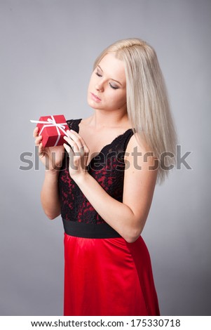 picture of lovely woman in black and red dress with present 