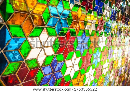 Colorful and shinny geometric star-shape stained glass perspective background