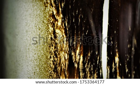 Bright photo of glaze on ceramics in brown and white. Macro photo.