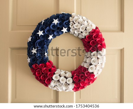 Yellow Door with an American Flag Wreath