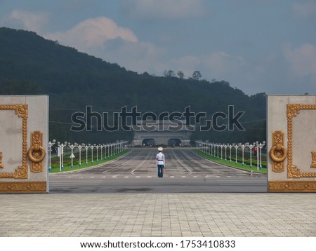 Lone North Korean guard watching over empty road, Pyongyang, North Korea Royalty-Free Stock Photo #1753410833