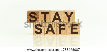 The wooden blocks say STAY SAFE. Concept image a wooden block and word - STAY SAFE. Royalty-Free Stock Photo #1753496087