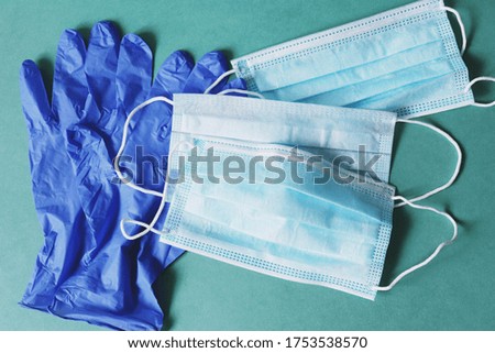 Blue latex gloves and disposable face masks view from above photo