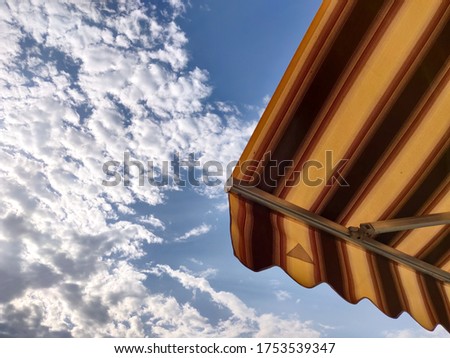 View of beautiful sky while sitting and relaxing under a shed