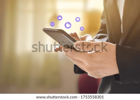 Businessman hands using mobile smartphone with icon and network connection. Concept of business or online marketing.