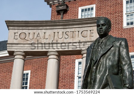 "Equal Justice" inscribed on the Thurgood Marshall Memorial, with statue of Marshall, outside Maryland State House, Annapolis, MD. Marshall was the first African-American U.S. Supreme Court justice. Royalty-Free Stock Photo #1753569224