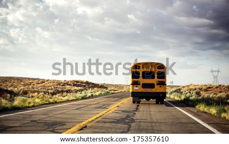Yellow school bus on the road, USA Royalty-Free Stock Photo #175357610
