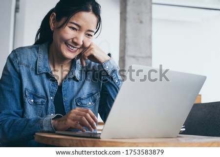 woman using computer.hand typing keyboard laptop online chatting search form internet while working sitting at coffee shop.concept for.technology device contact communication business people