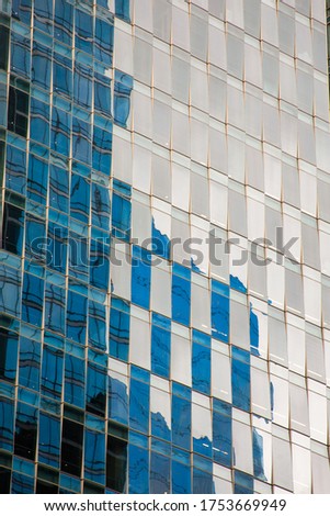 Glass facade of a postmodern office building, taken in downtown San Francisco