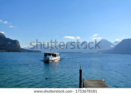 There is a yacht on Lake Hallstatt in Austria.