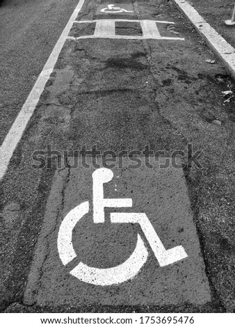 Road signs for parking the disabled on the road surface