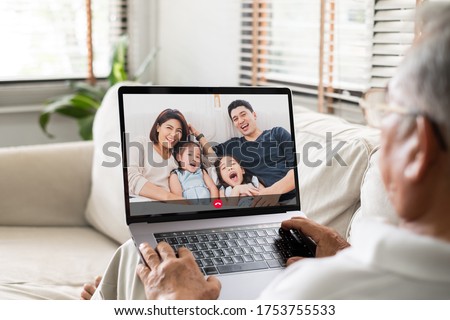 Asian old senior video call virtual meeting with family Royalty-Free Stock Photo #1753755533