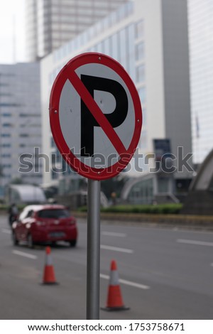 The sign of do not park here for vehicles.