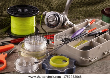 Spinning and fishing rods on an old background