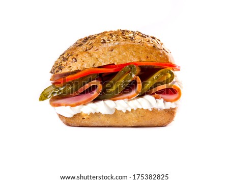 Sandwich with meat and vegetables on white
