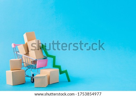 Picture of shopping cart carrying large parcels arrow going up developing export sales management online boutique isolated over bright vivid shine vibrant blue color background Royalty-Free Stock Photo #1753854977