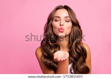 Just for you. Photo of pretty attractive curly lady send air kisses open palm flirting boyfriend tempting lips wear white casual singlet isolated bright pink color background Royalty-Free Stock Photo #1753855691