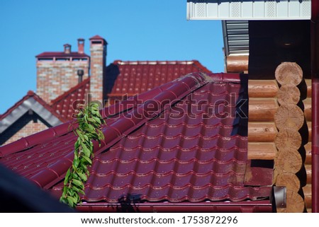 Roof of the house. Trumpet. Wood and roof tiles. Architecture. Texture. Buildings and structures. High quality photo