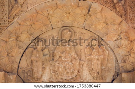 Images of Christ at the entrance of the church wall. Noravank