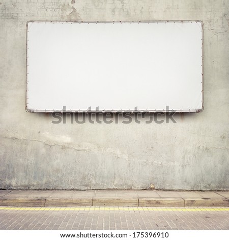 Blank advertising billboard on a street wall.