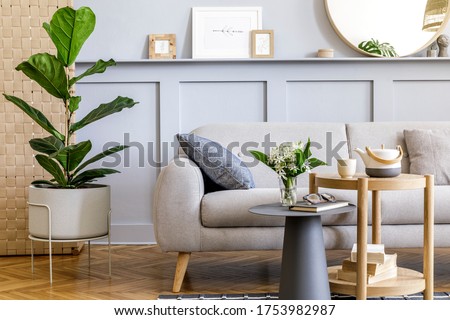 Scandinavian concept of living room interior with design sofa, coffee table, plant in pot, lamp, carpet, plaid, pillow, shelf, decoration and personal accessories in modern home staging. Royalty-Free Stock Photo #1753982987