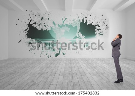 Thinking businessman with hand on chin against splash on wall revealing global graphic