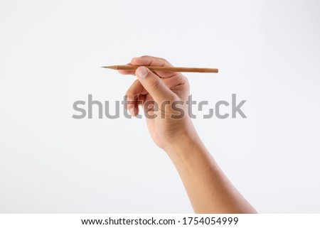 holding pencil  isolated on white background, concept educational, draw a picture, design