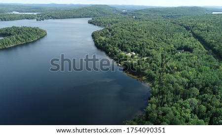 Major island on campion Lake aerial pictures from drone. Pictures represent the lake and the island with nearby cottage