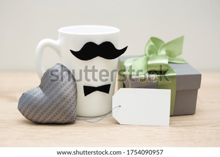 Father's day concept.Coffee cup, gift box and handmade heart. Copy space.