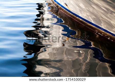 Boat Reflection on the Sea Water Photo