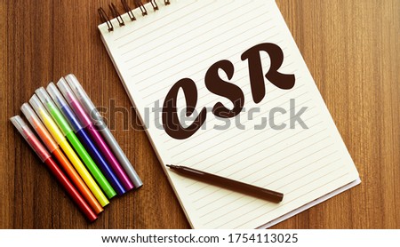 CSR your future target searching A cup of cappuccino, glasses, a marker, pen, three colored pencils and a notebook for writing