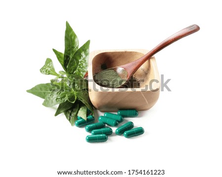 Andrographis paniculata and Herbal Capsule on a white background, photography