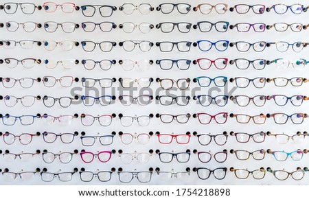 dioptric glasses on the shelf of an optometric clinic and glasses store. Blurred background Royalty-Free Stock Photo #1754218898